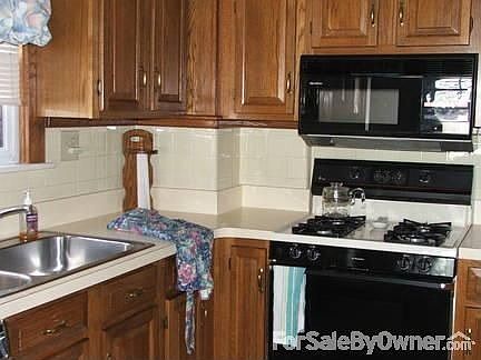 Cooking area no. 1 : Microwave and stove will stay. Kitchen area 16.5x8