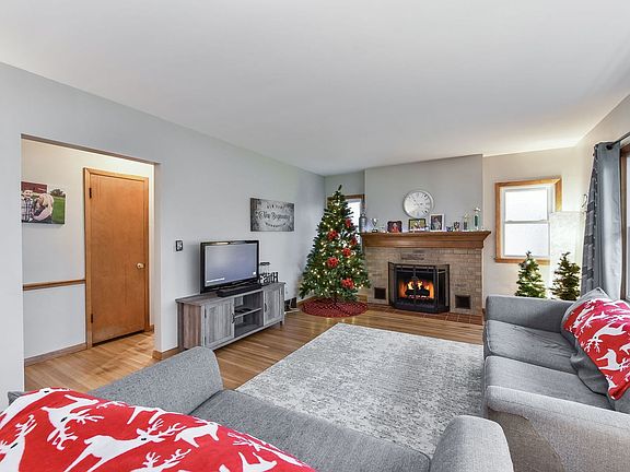 Large living room with a charming fire place.