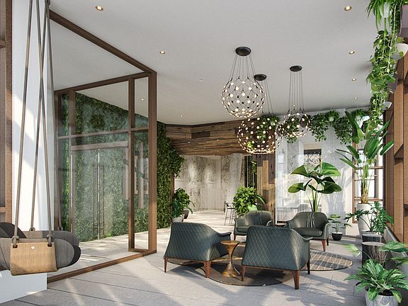 Welcoming lobby with a communal table for flexible work options or simply catching up with friends