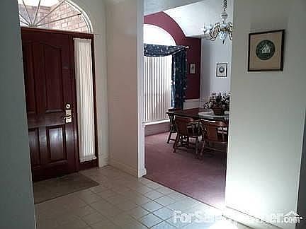 												Foyer and dining room both have stunning arched ceilings, beautiful chandeliers.
