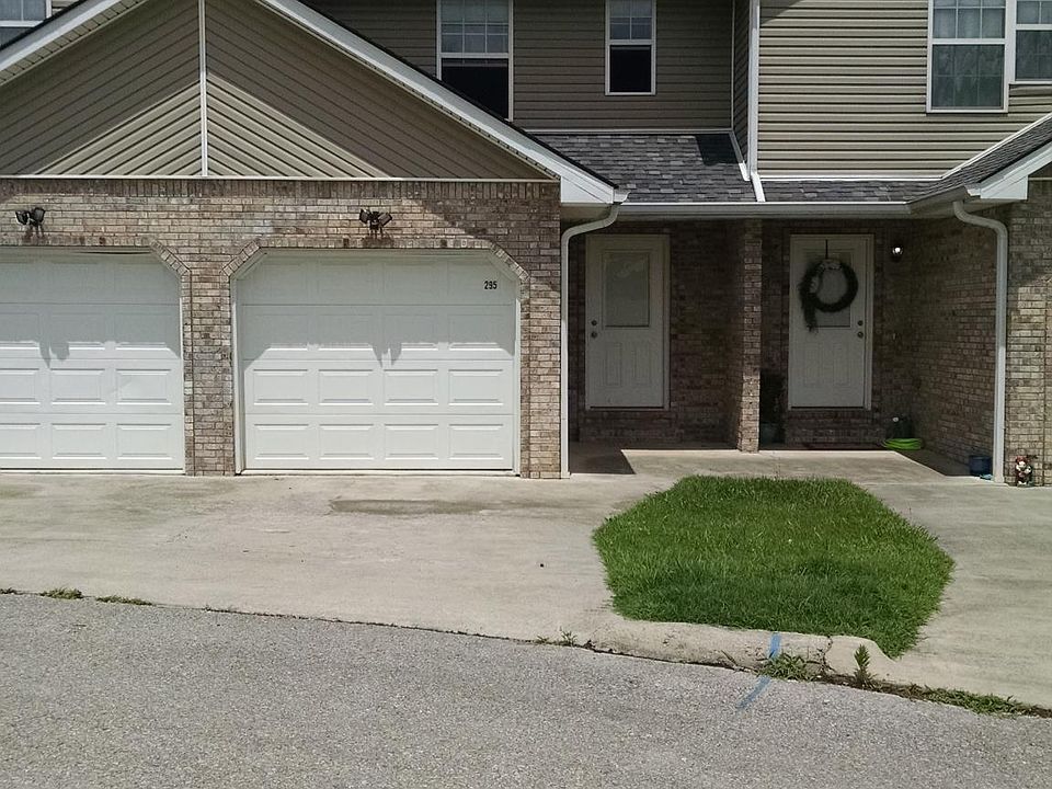 Private entrance and 1 car garage with opener. Extra parking on pad outside garage