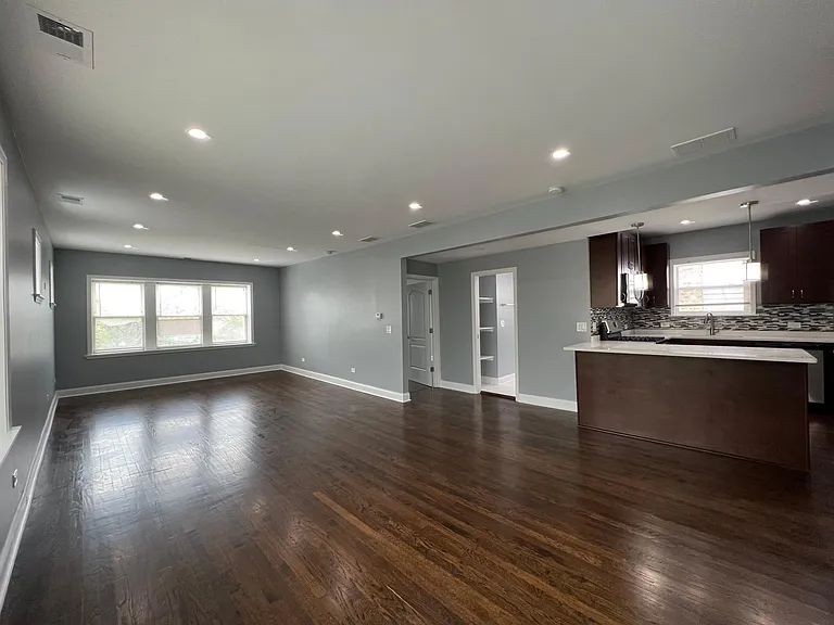 Living room, dining room, and kitchen (view from the dining room)