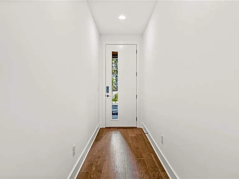 Unit Entrance (Note: Actual unit has light wooden floors and upgraded fixtures / appliances)