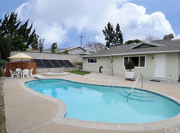 Another shot of the pristine pool, and the solar that heats it (Solar is paid for, no lease)