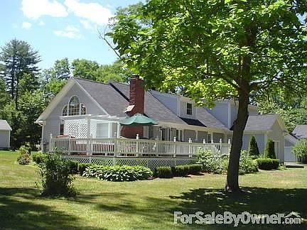 Main house with large deck
						:
						enjoy the lake and mountain views on your deck or in the hot tub