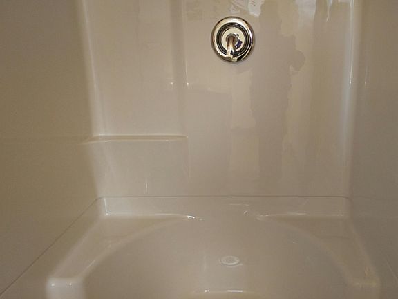 HUGE new shower has nice built in seats