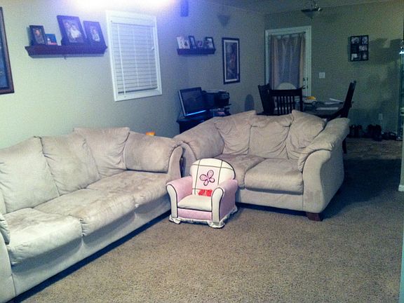 Living room with open dining area.