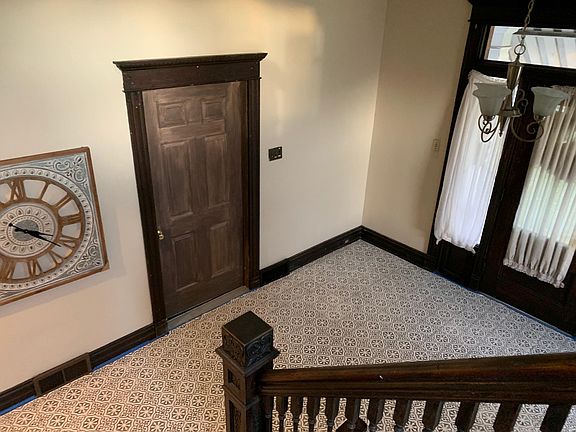 The brown door is the entry to apartment 1B.