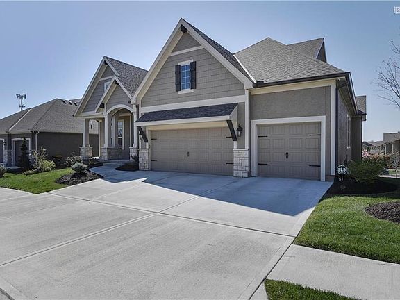 Four bedrooms (2 on main level including Master BR), 3.5 bathrooms and 3 car garage.  Driveway is fully extended in front of each parking space.