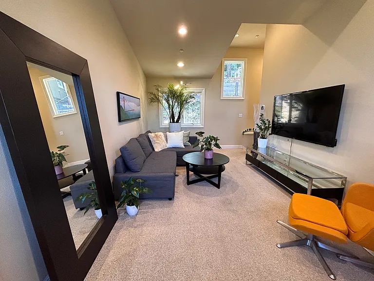 Furnished living room with heigh ceilings