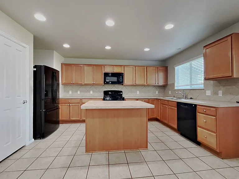 Spacious kitchen features warm