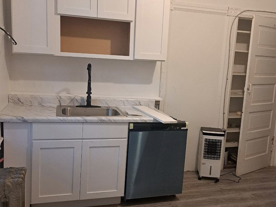 11x12 ft New kitchen being installed. New laminate floors, dish washer, microwave, gas range and pantry.