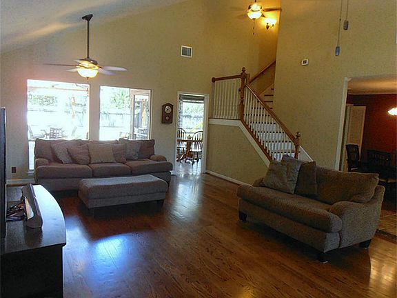 Open wood staircase, wood floors, high ceilings, what else could you want?