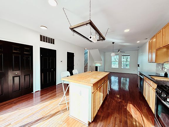Kitchen (left double door is furnace room, middle door is in-unit laundry, third door is the powder room)