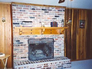 Wood burining fireplace in great room.