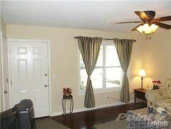 Family room with Refinished Hardwood Floors