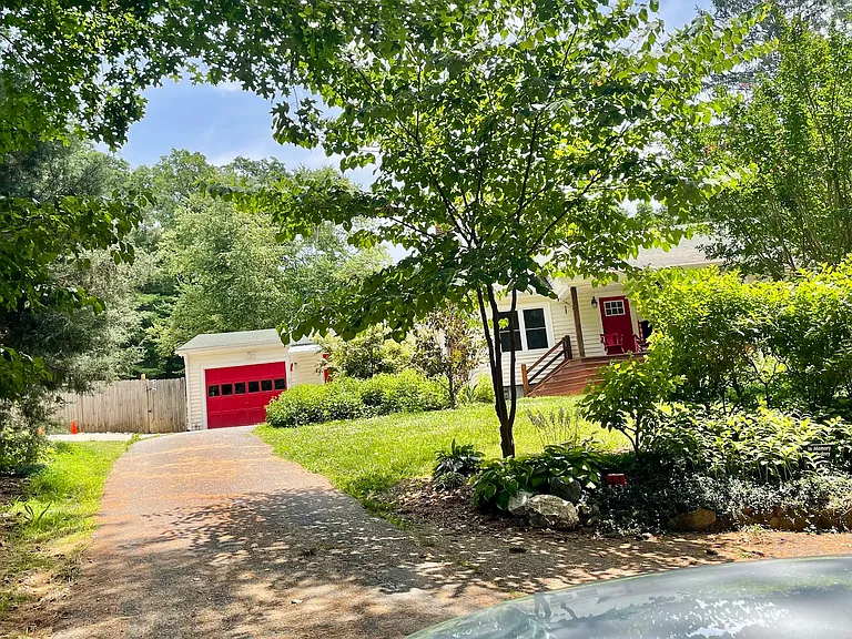 The red garage door has a remote and will by yours if you want to use it.