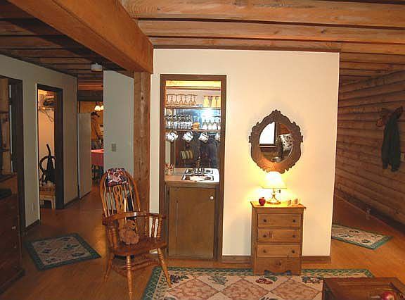 The wet bar is convenient to the living room and the den.