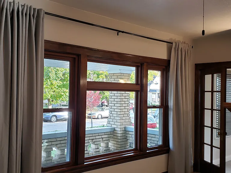 Check out the lovely drapes in the living room window. Good looking and very practical for privacy. Lots of natural light during the day!