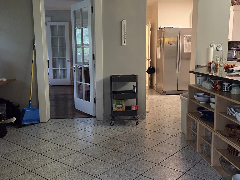 Another view of the first floor kitchen with a view into the dining room.