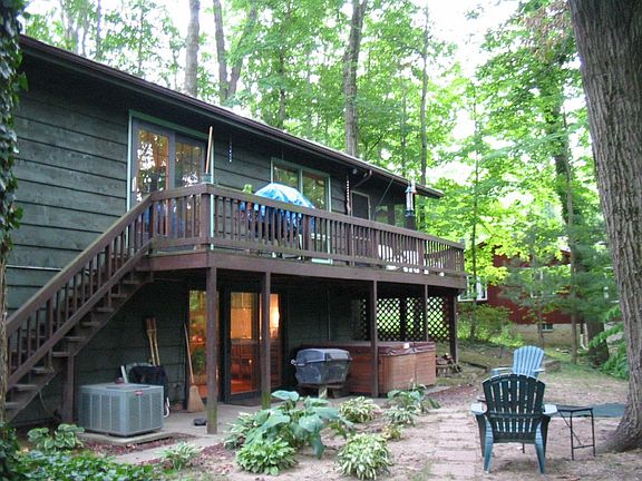 back of home, elevated deck, shows walkout basement