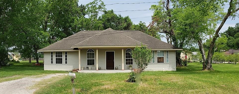 Front of your home with a new wood front door.
