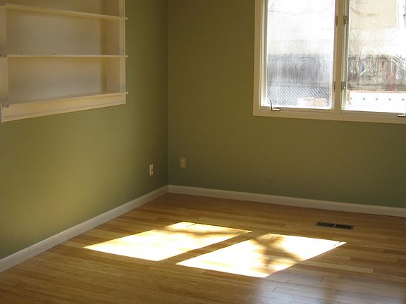 Living room with built in book shelf.