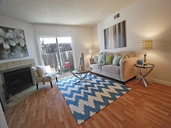Large living room w/ fireplace perfect for entertaining!