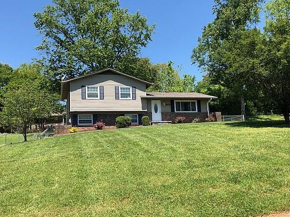 Large front yard. Quiet neighborhood. Speed bump in front of house.