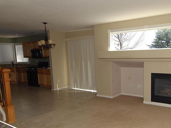 Family Room adjacent to Kitchen Eat in Space with Access to Back Patio.