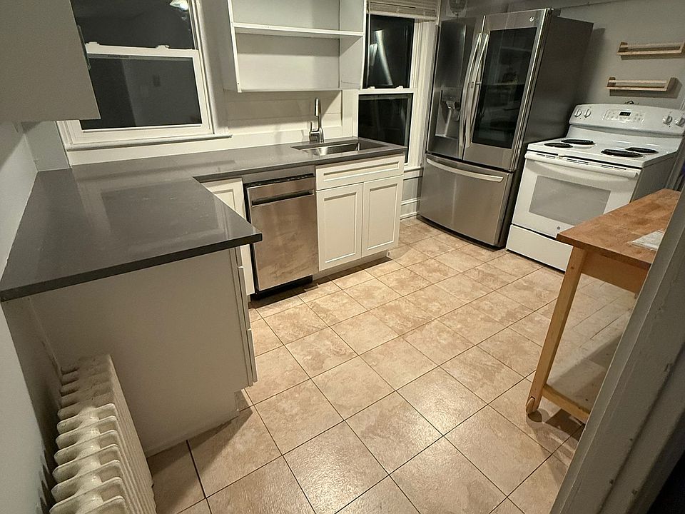 new cabinets, counter, refrigerator and dishwasher