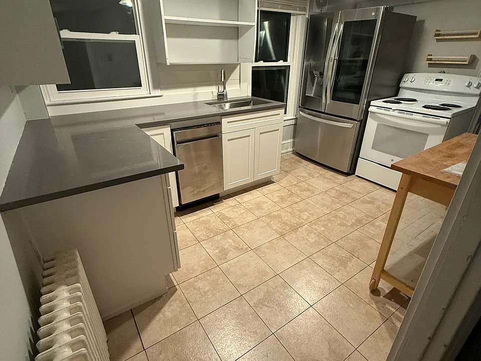 new cabinets, counter, refrigerator and dishwasher