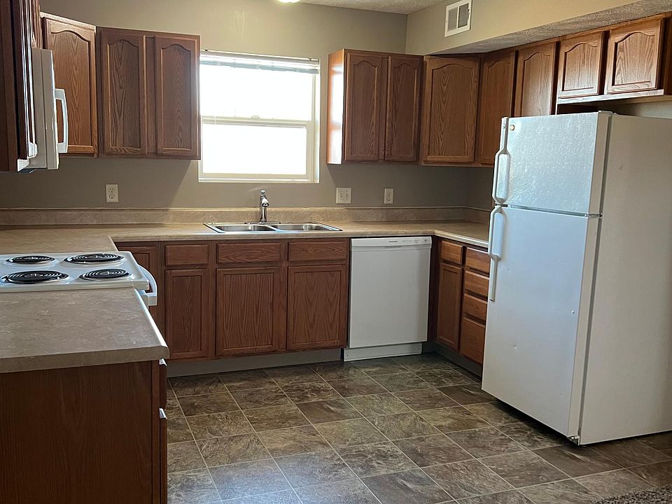 Kitchen with full size fridge, dishwasher, oven/stove, microwave