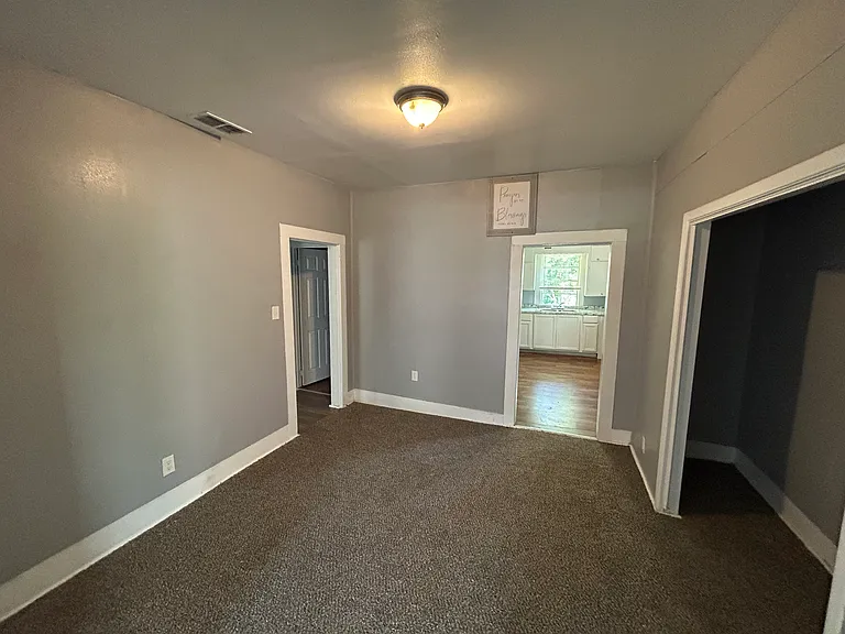Big formal dining room with big half-closet storage area.