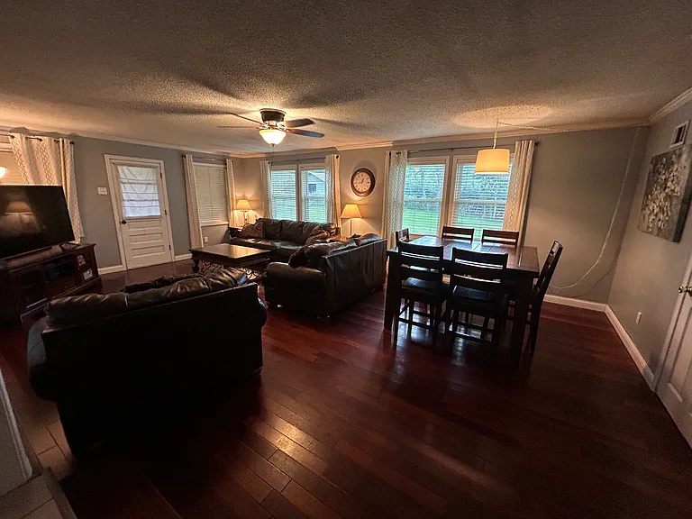 The main living room at the rear of the home provides plenty of space for relaxation and productivity.