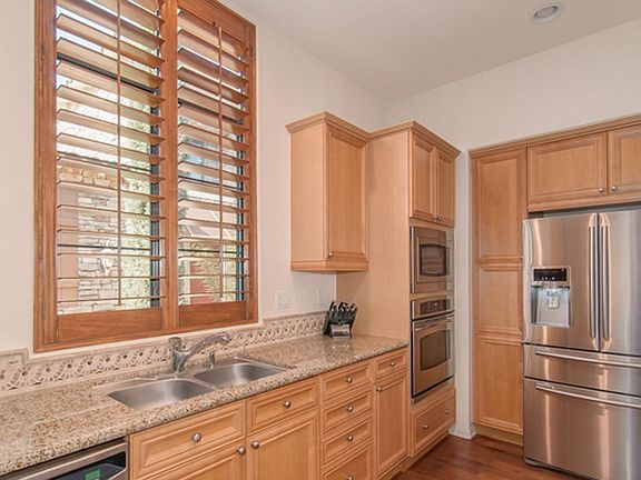 Kitchen with hardwood floors, gas oven, and 5-burner gas cooktop