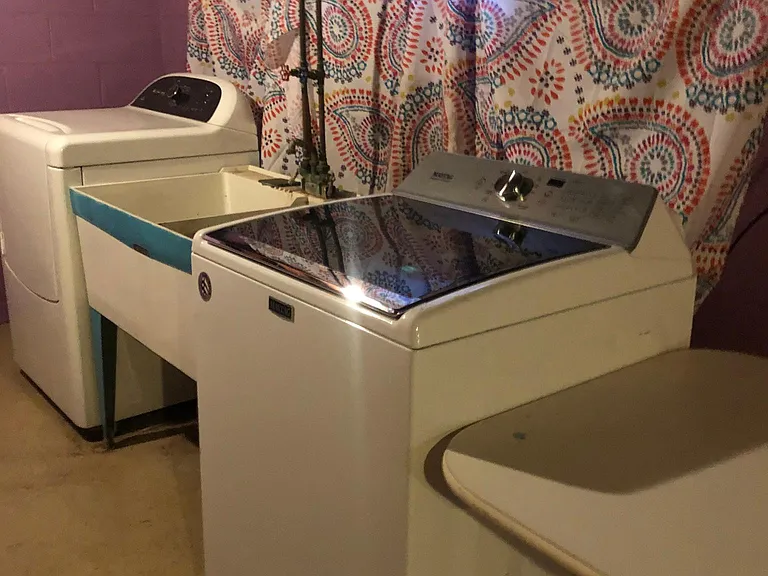 Washer and dryer in basement.