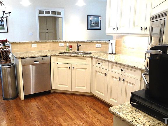 Hardwood Floors, Granite Countertops, Under cabinet lights and moldings, Stainless Steel appliances, Full Frameless Glazed Raised Panel 42" cabinetry.