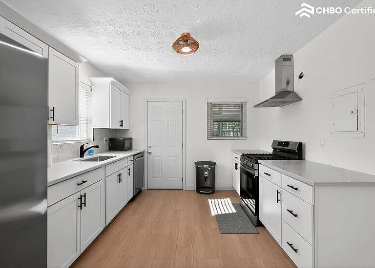 Stainless steel appliances, granite countertops.