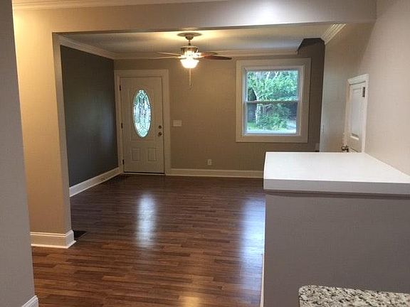 Inviting living room with staircase to upstairs.