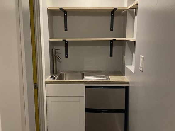 Kitchen/bathroom sink. Mini fridge with freezer included