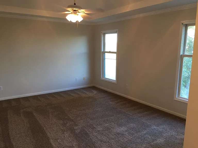 Looking in to Master bedroom / 2 windows