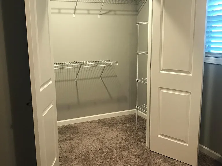 Lg walk-in in lg bedroom. The same size walk-in is located smaller bedroom as well.