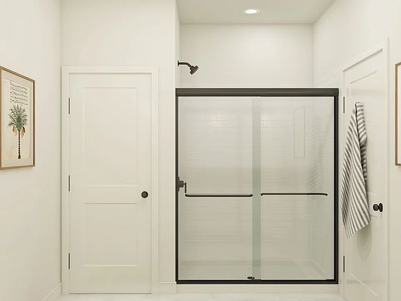 Primary bath with glass shower enclosure