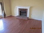 Hardwood floors in den, working fireplace