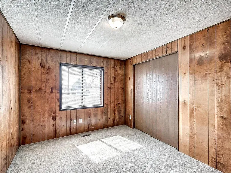Nice sized Bedroom 2 with window south toward South Table Mountain and large closet.