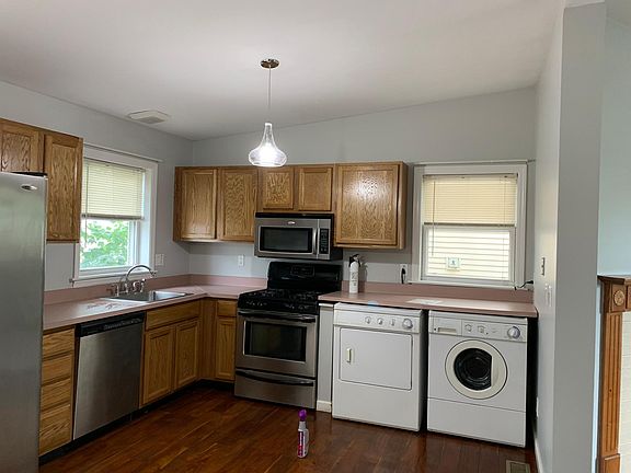 Kitchen with washer and dryer