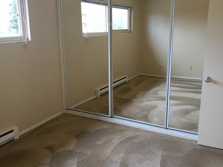 Bedroom looking at closet doors