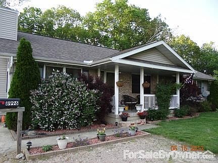 Front view of porch
						:
						Lilac bush in full bloom!