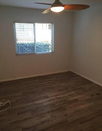Bedroom: Brand new floors, paint, and ceiling fan.